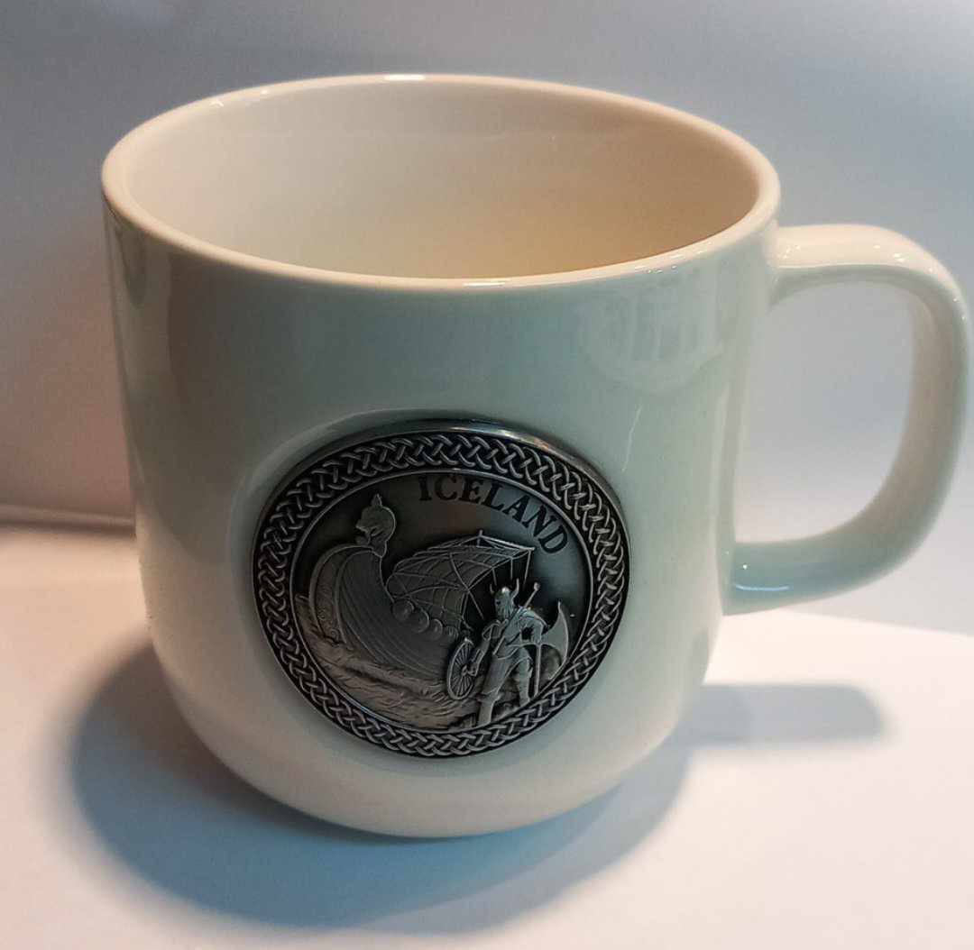 Ceramic cup with viking design