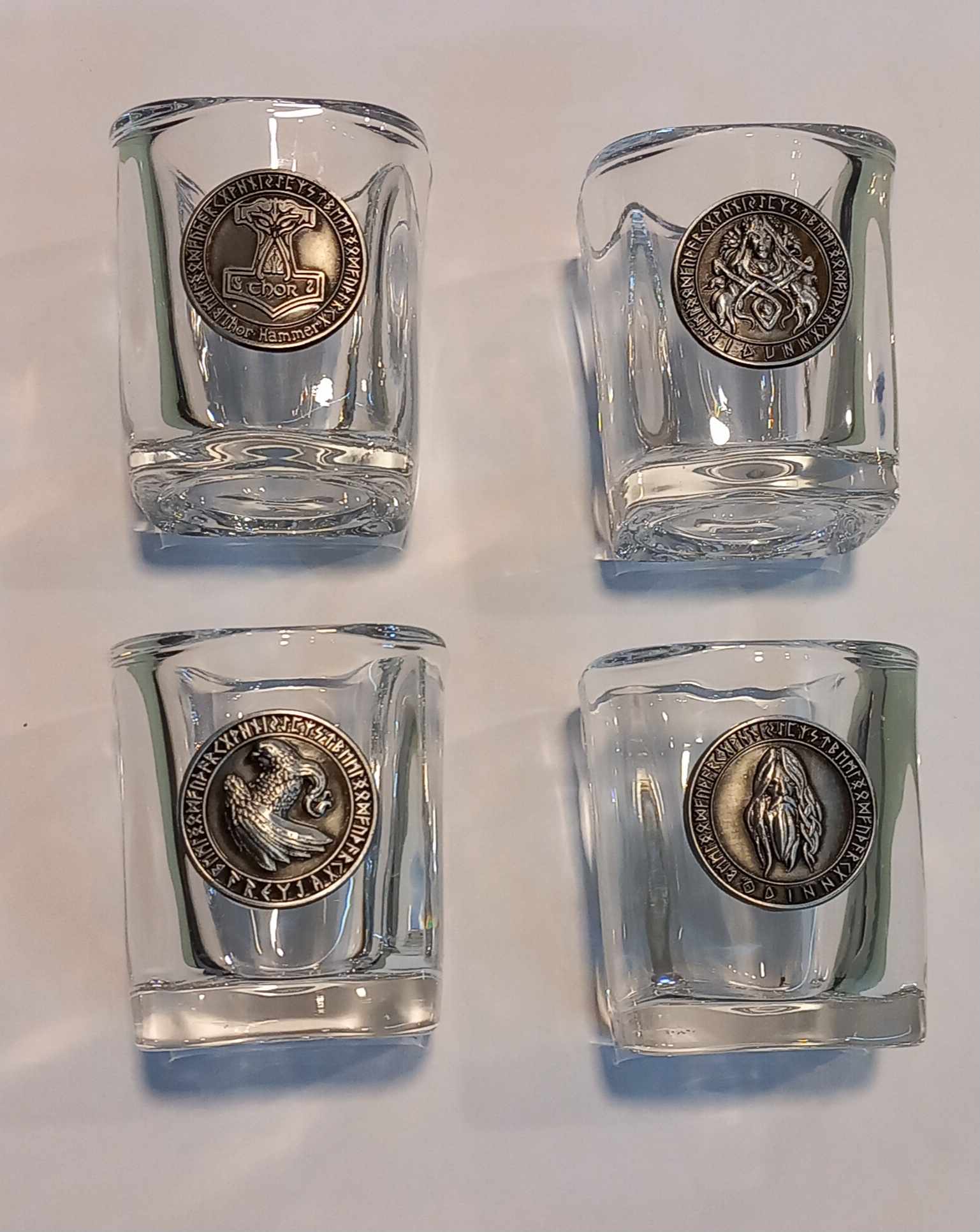 Shot glass with stainless steel designs