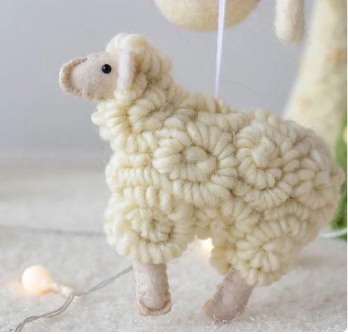 Handwoven sheep-shaped ornament.